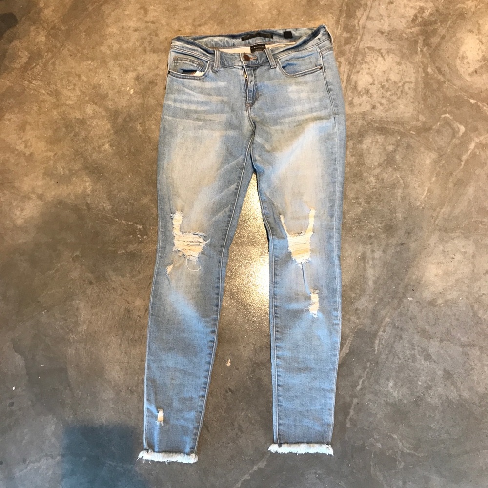 Light distressed denim skinny jeans